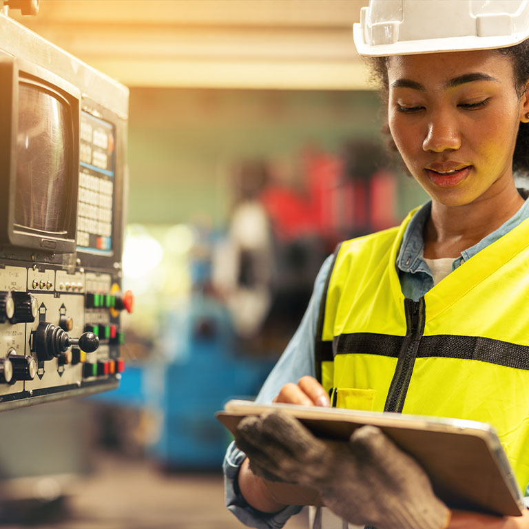 female electrician checking circuit board
